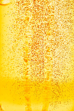 Golden beer bubbles macro texture background