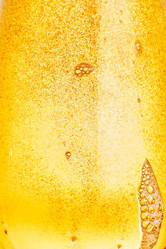 Macro Close-Up Texture of Carbonated Golden Beer Bubbles