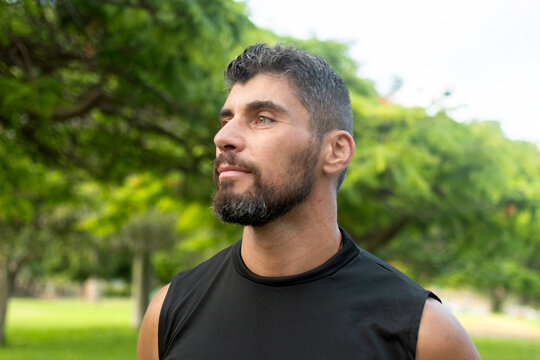 Athletic man looking ahead outdoors