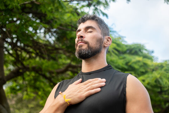 Man practicing mindful breathing outdoors