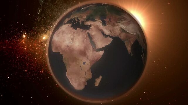 Earth globe illuminated by the rising sun floats in the dark expanse of outer space.