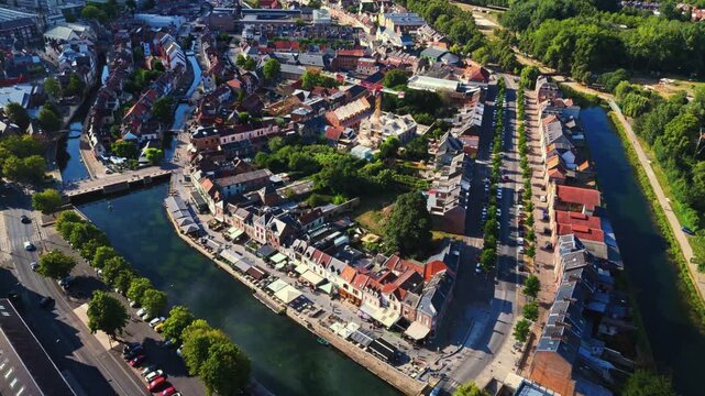 Amiens is a historic northern French city bisected by the Somme River, famous for its floating gardens, brick architecture, vibrant quarters, and rich medieval, industrial, and literary heritage.