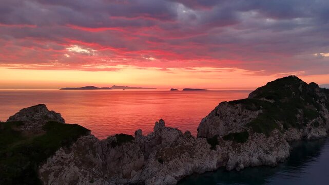 Dramatic red sunset over Corfu with Diapontia Islands