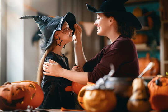 Happy Family Halloween Celebration at Home with Mother and Daughter