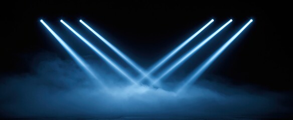 Obraz premium On a dim concert stage, vivid blue lights form a striking chevron through dense fog, enhancing the energetic atmosphere.