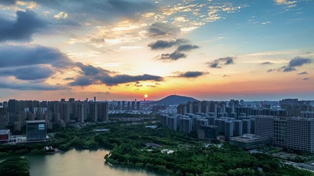 Hefei Dashu Mountain Aerial Timelapse: Sunset Melts Gold Over City and Hills, TV Tower Stands Amid Green Canopy