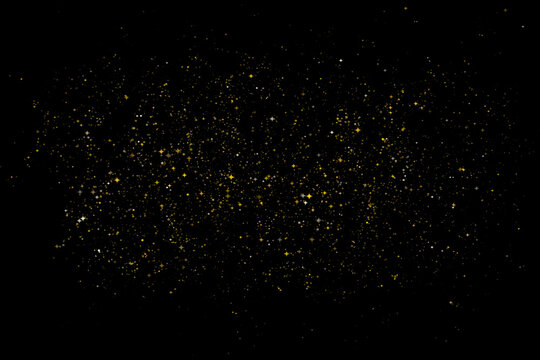 Golden glitter dust particles on black background. Luxury gold sparkles and shimmering sand texture. Elegant glowing stardust vector illustration for holiday celebration.