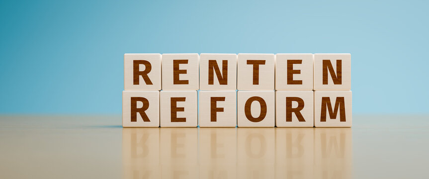 "Rentenreform" (pension reform) built with toy cubes. A pension reform is in discussion in Germany. Web banner format