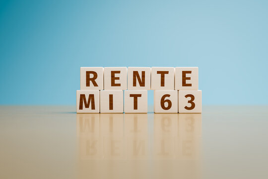 German text "Rente mit 63" (pension from age 63) built with toy cubes. A pension reform is in discussion in Germany. Copy space