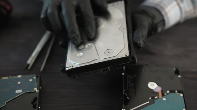Service Technician Holds A Hard Disk Drive During Computer Storage Hardware Maintenance And The Data Recovery Process In Service Center