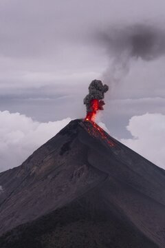 Glowing lava and smoke spitting volcano, volcanic eruption, Volcan de Fuego, Guatemala