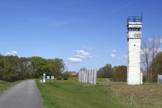 An old watchtower next to a road in a rural landscape, GDR border, Neu-Bleckede, spring, bicycle tourism, bicycle travel, Mecklenburg-Western Pomerania, Germany