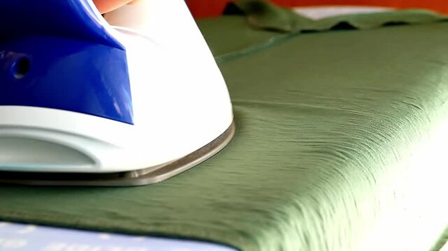 The green blouse is ironed.