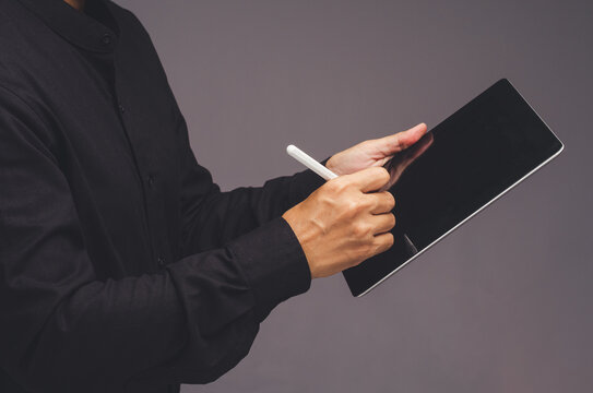 Person using tablet with stylus for digital note taking