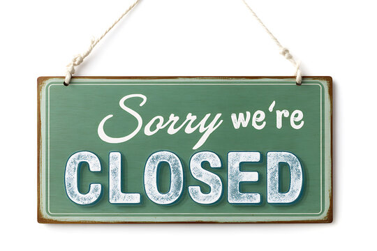 Rectangular green sign with white lettering reading sorry we re closed hanging by ropes