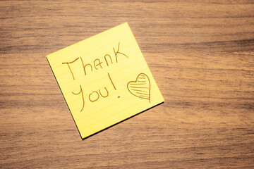 A handwritten note with the text Thank You  on it. © Sonny