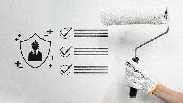 Gloved hand holding a paint roller against a wall, overlaid with icons representing construction worker safety and a checklist. Occupational safety concept