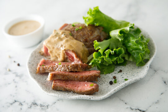 Beef steak with peppercorn sauce