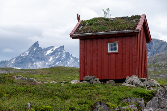 Red Norwegian Cabin with Sod Roof in Romsdalseggen Mountain Landscape, M&oslash;re og Romsdal, Norway