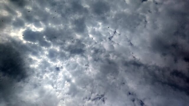 Clouds no action static scene, in sky, with clouds, from a aerial perspective, with gray, white accents, and serene mood, showing nearby objects and surrounding setting, nearby objects.