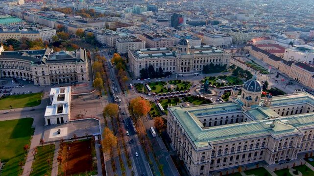 Aerial drone view of the Ringstrasse boulevard with trams, the Kunsthistorisches and Natural History Museums, Maria Theresien Platz and the Neue Burg, Vienna, Austria, in autumn.