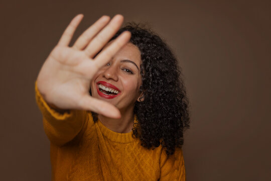 Adult woman making stop gesture with her hand