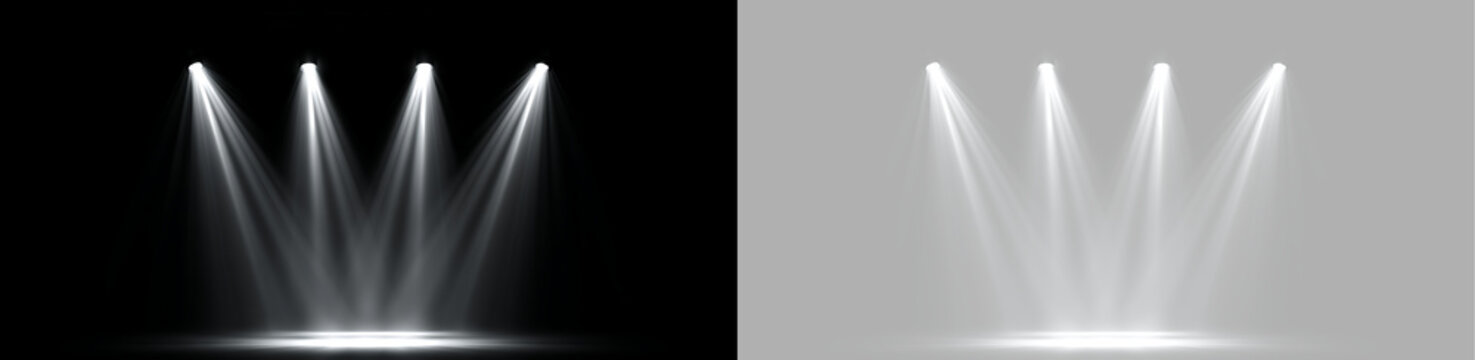 Four white stage spotlights lighting up a scene. Bright spotlight beams on transparent background