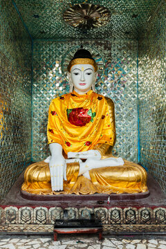 Buddha statue in Burma famous sacred place and tourist attraction landmark - Shwedagon Paya pagoda in Yangon, Myanmar