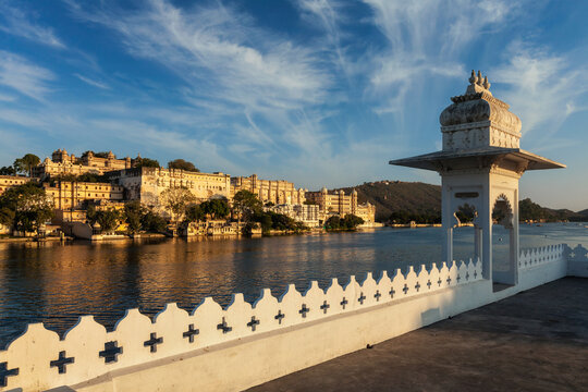 India luxury tourism concept backdrop - Udaipur City Palace from Lake Pichola. Udaipur, Rajasthan, India