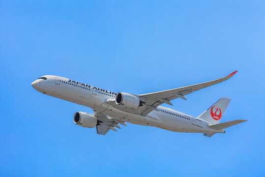 Japan Airlines (JAL) Airbus A350 climbing after departure with gear retracted on September 21, 2025 in Tokyo, Japan.