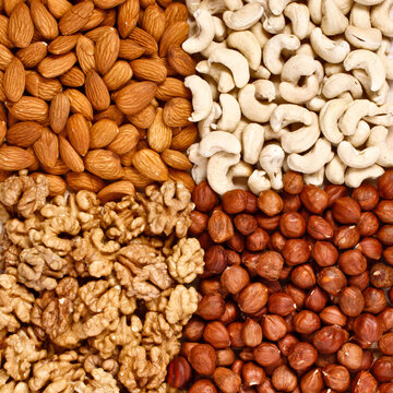 Different nuts (almons, cashews, walnuts alongside filbers) close up