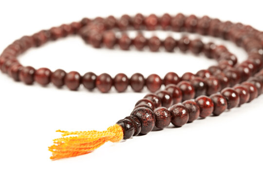 A japa Mala - Buddhist or Hindu prayer beads isolated on white