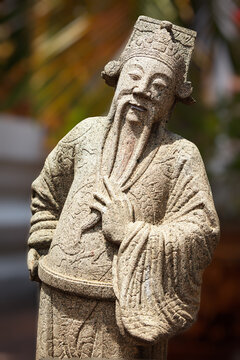 A chinese stone guardian statue in Wat Pho Buddhist Temple , Bangkok, Thailand