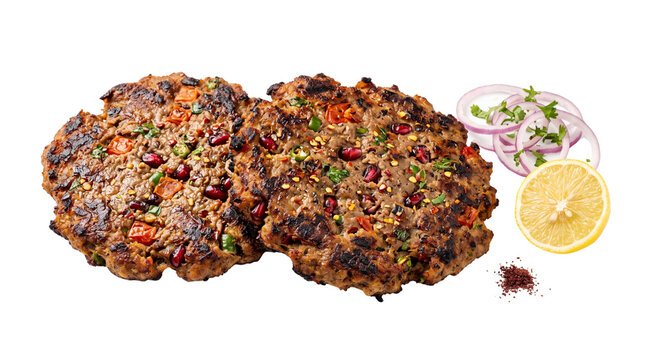 Traditional Chapli Kebab with red onion and lemon, grilled minced meat patties with spices, authentic Pashtun cuisine isolated on white background