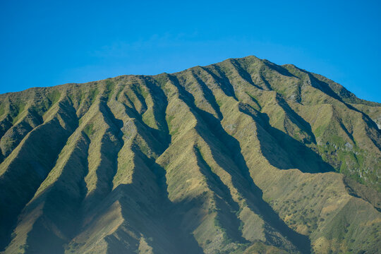 The striking, ribbed landscape of Widodaren Hill, located in the Bromo Tengger Semeru National Park in East Java, Indonesia.