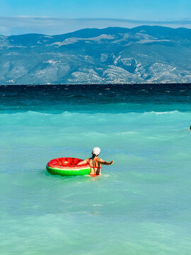 Person floating on ring in Adriatic sea