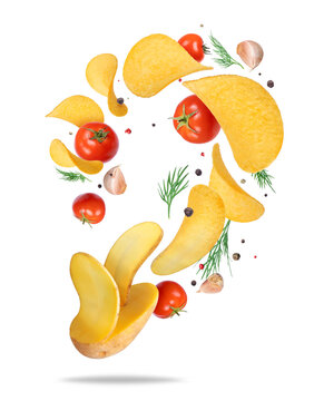 Potato chips floating in the air with dill and tomatoes isolated on transparent background
