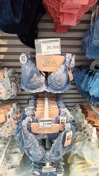 Royan, France - July 25, 2026: E.Leclerc ROYAN CEDEX. Display of various women's lingerie including lace bras in blue and pink colors on a retail shelf with price tags visible