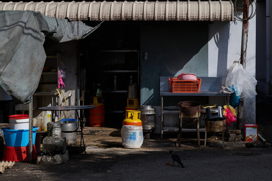 Traditional Asian restaurant back kitchen with vintage cooking equipment and preparation area