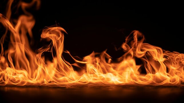 Flame fire burning brightly on black background with glowing light and abstract energy, dramatic flames creating a powerful heat, danger and natural fire concept