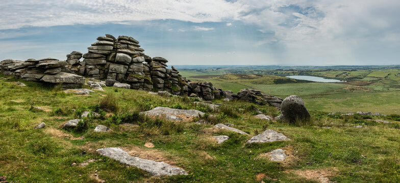 Lovely Summer day landscape image of Rough Tor on Bodmin Moor in English countryside