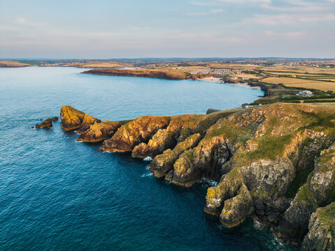 Stunning peaceful Summer sunset landscape over Trevose Head in Cornwall England