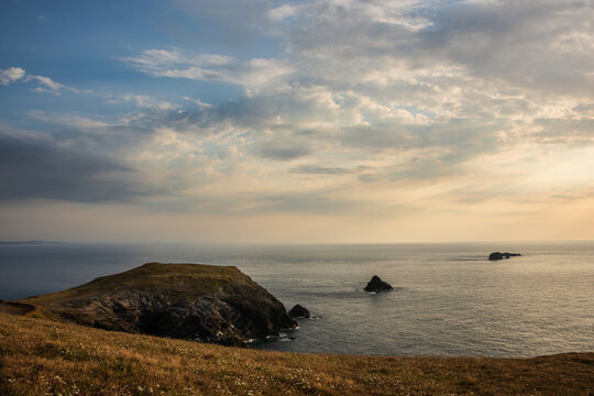 Stunning peaceful Summer sunset landscape over Trevose Head in Cornwall England