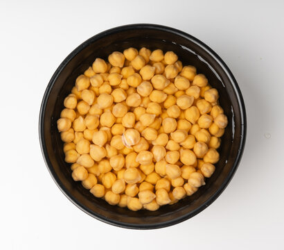 Soaked chickpeas, chick pea in water, swollen wet Cicer arietinum fruits, garbanzo beans cooking
