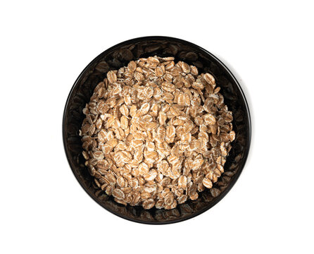 Spelt flakes isolated, dry raw rolled flat oat grains, wheat, oatmeal or bran, barley rye cereals