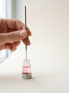 Woman Hand Extracting Plant Stem Cells Serum with Micro Needle Tool