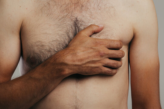 a young man with a slender figure and a hairy body in underwear. Body parts: the toned torso of an athletic guy. a man undergoes a body examination at a private clinic