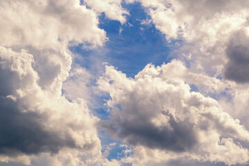 Fototapeta premium Dramatic Blue Sky With Large Cumulus Clouds, Sunlit Highlights and Atmospheric Texture