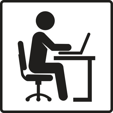 Simple black icon of a person working on a laptop computer at a desk.