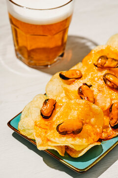 potato chips topped with pickled mussels